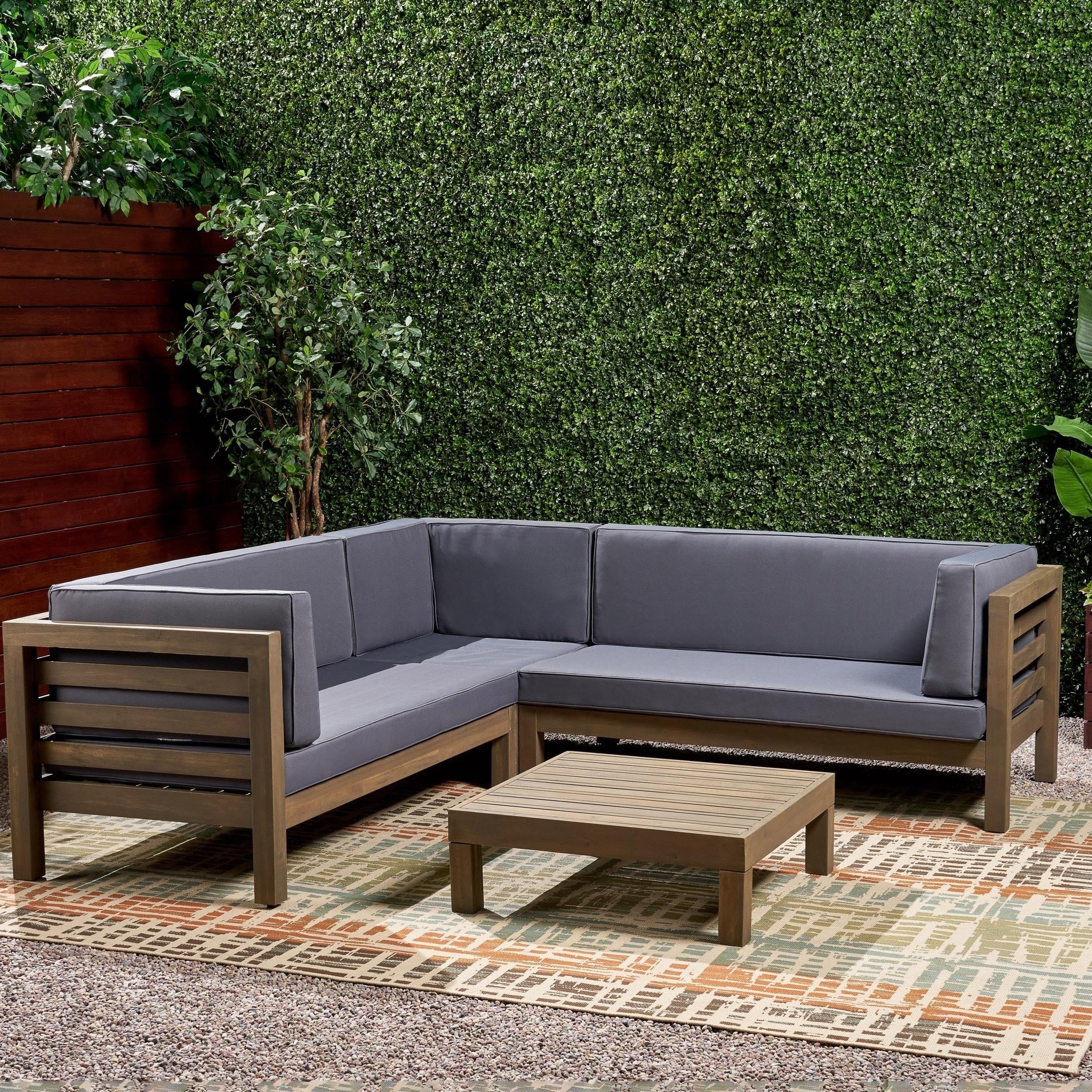 Oana Outdoor 5 Seater V Shaped Mid-Century Modern Acacia Wood Sectional Sofa Set with Coffee Table by Christopher Knight Home